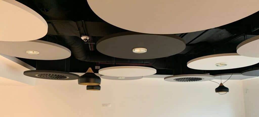 Mix of black and white multi nozzle diffusers in an open ceiling at Highfurlong School, Blackpool.