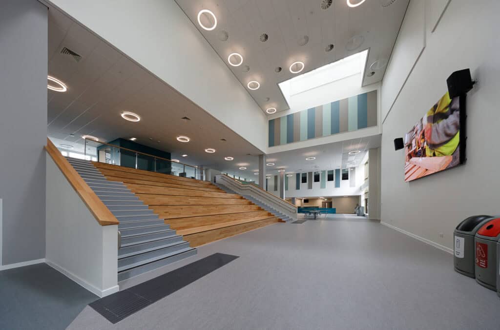 Auditorium in a learning campus showcasing air distribution grilles