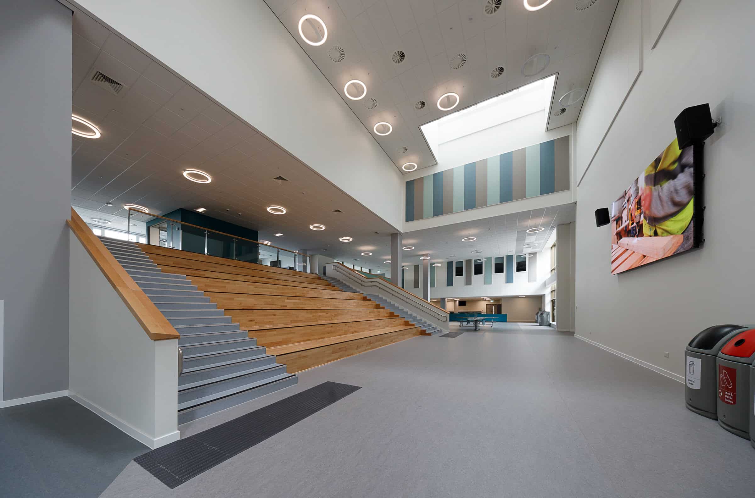 Auditorium in a learning campus showcasing air distribution grilles