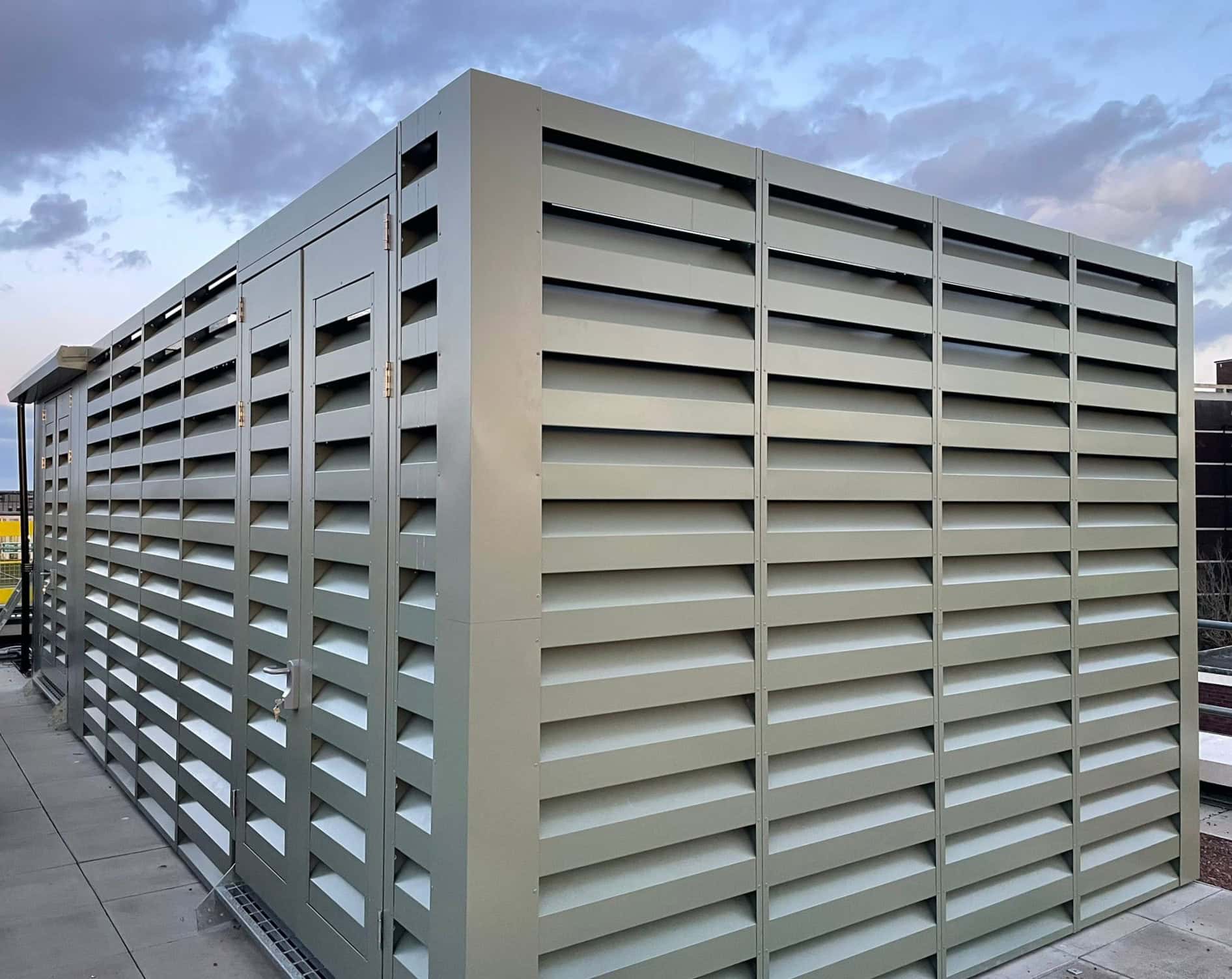 Silver acoustic louvre enclosure on rooftop